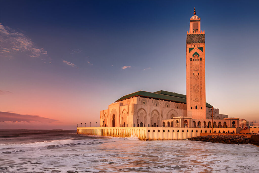 Hassan II Mosque in Casablanca at sunset overlooking the Atlantic Ocean