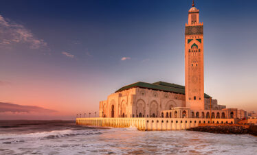 Hassan II Mosque in Casablanca at sunset overlooking the Atlantic Ocean
